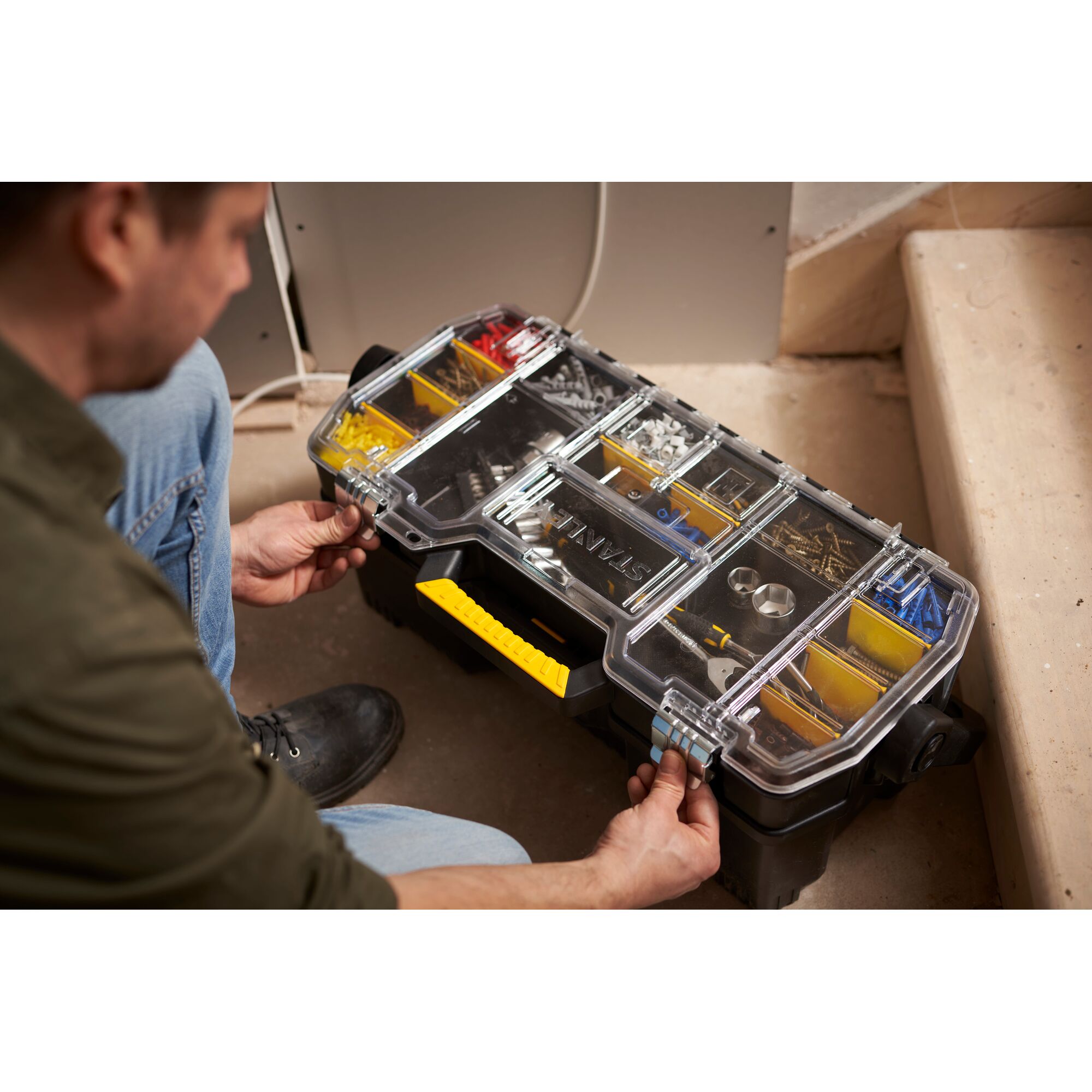 STANLEY 1-97-514 organiser box with clear lid, yellow handle, assorted compartments, photo in use.