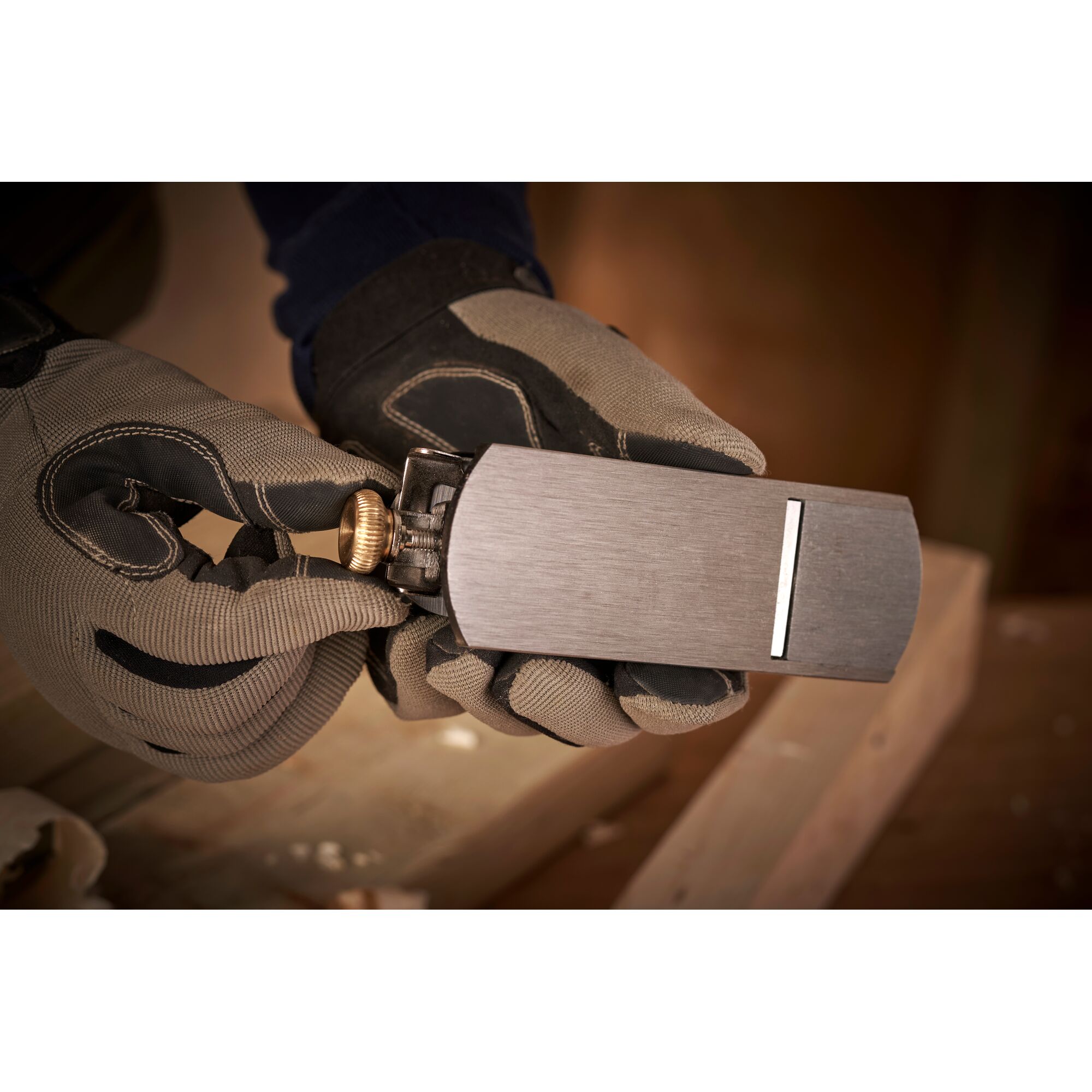 Photo of STANLEY 12-020 block plane held in gloved hands, woodwork setting visible.