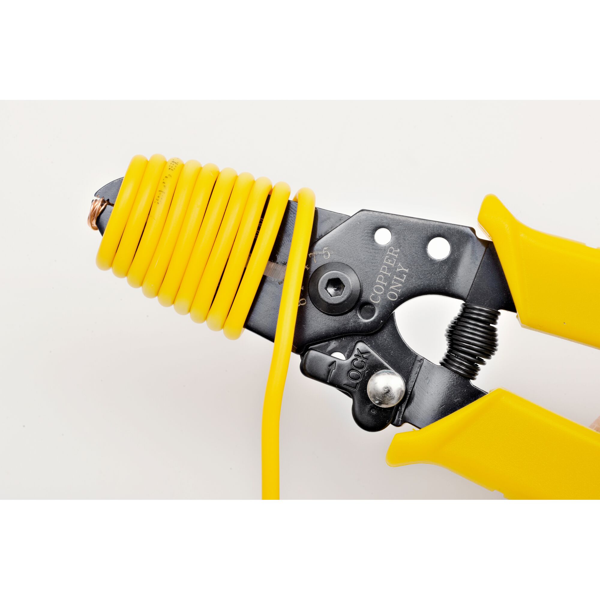 STANLEY 84-475-22 wire stripper with yellow insulated handles, coiled yellow wire, close-up angle.