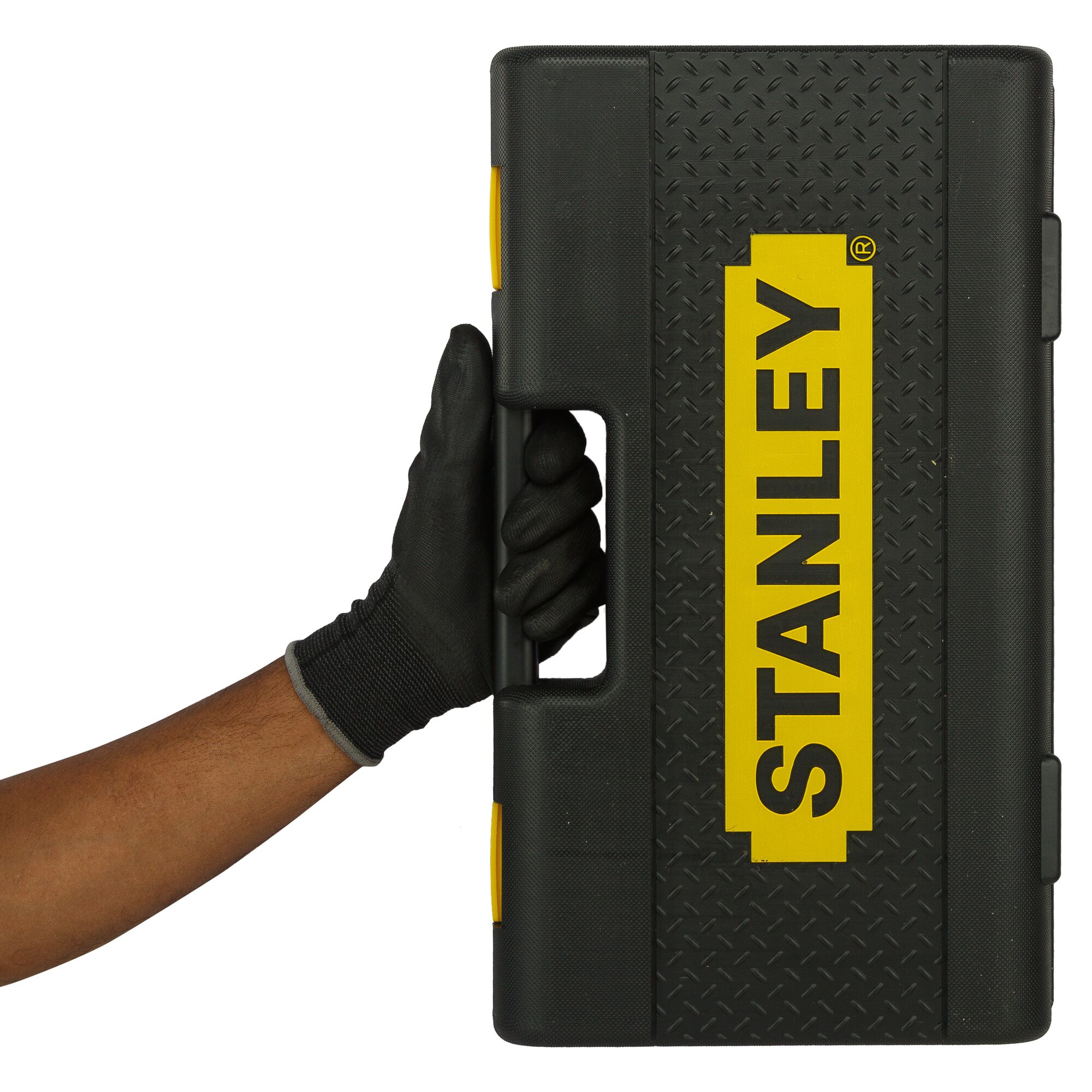 STANLEY 86-477 black tool case with yellow logo, held by gloved hand, front view, photography.