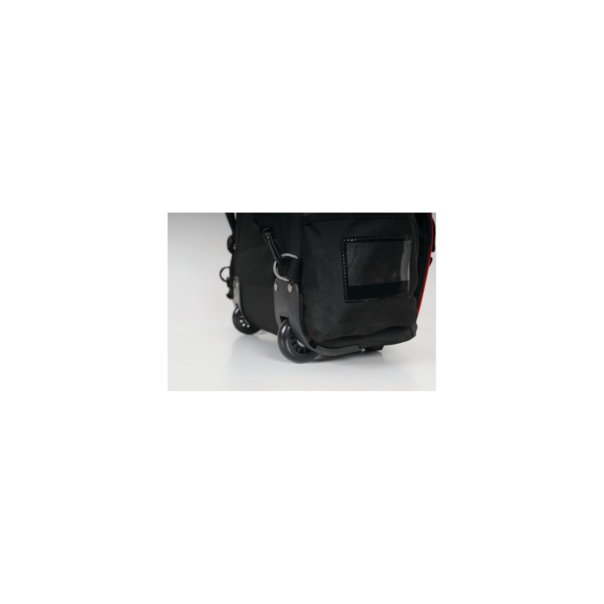 STANLEY FMST514196 tool bag corner showing black fabric, wheels, and plastic frame, close-up angle.
