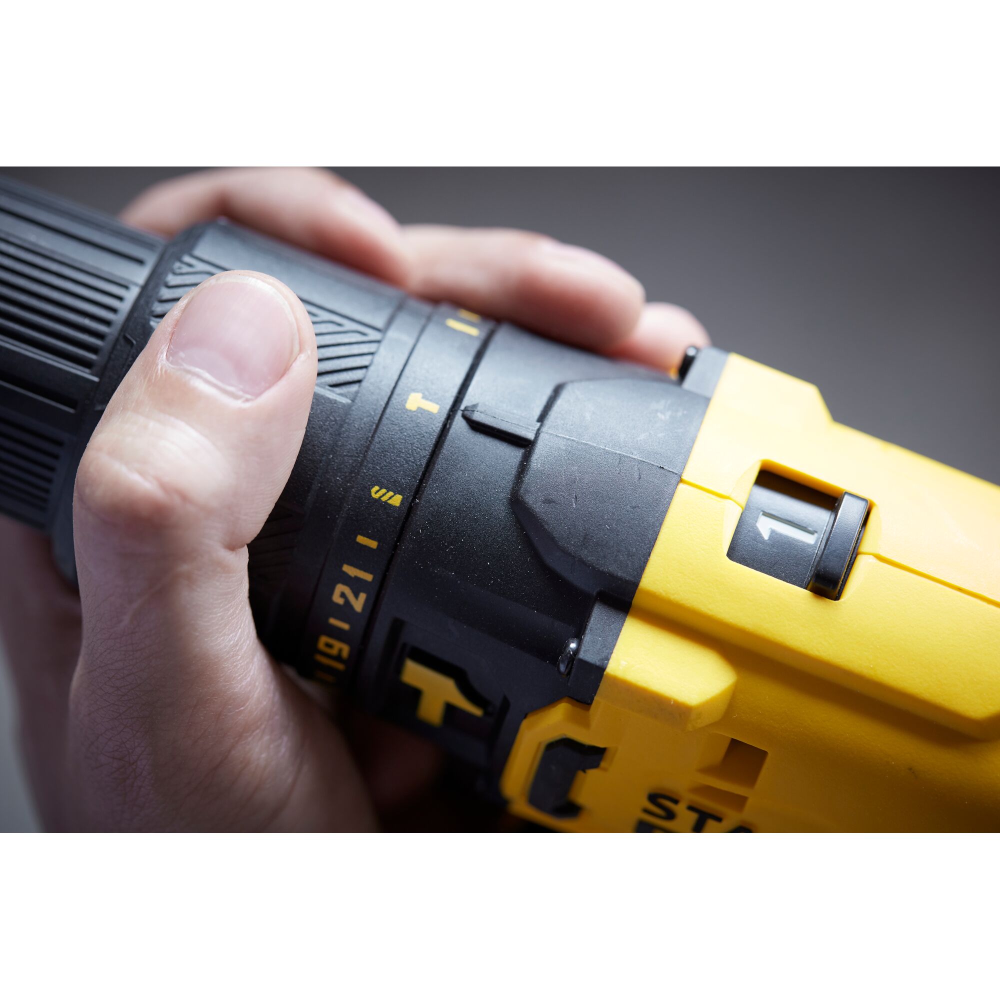 Close-up photo of STANLEY SCD711C1H-B2 cordless drill showing yellow body and adjustment dial.