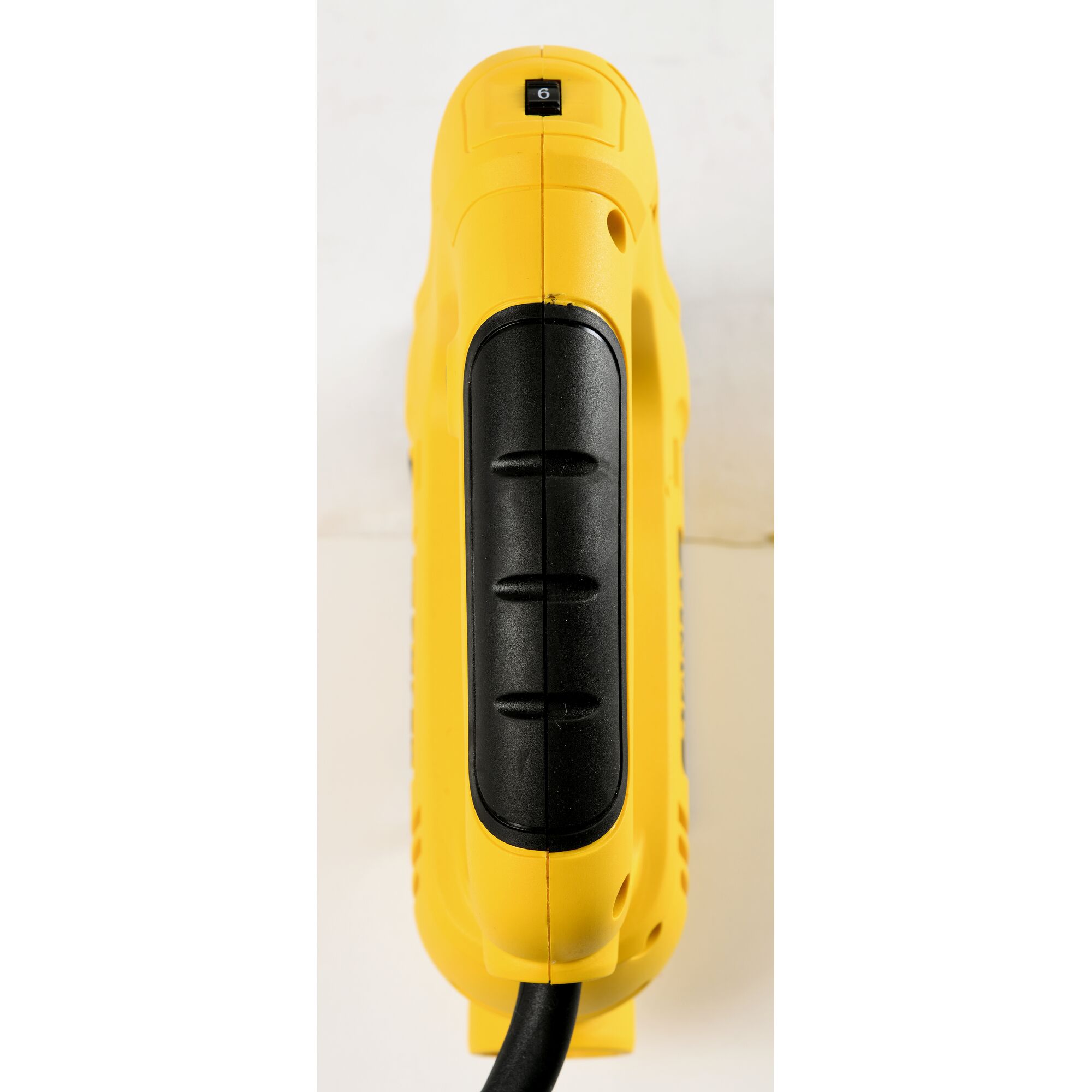 STANLEY SJ60 yellow and black power tool handle, top view, photography product on white background.