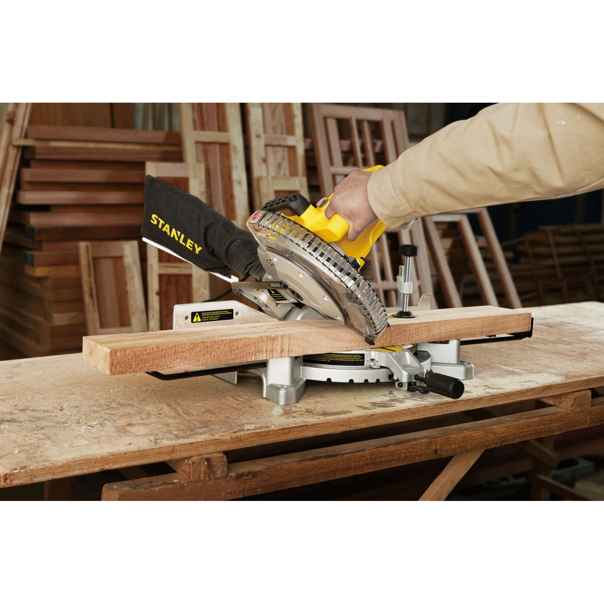 STANLEY SM16-B3 miter saw cutting wood in workshop, close-up side angle.