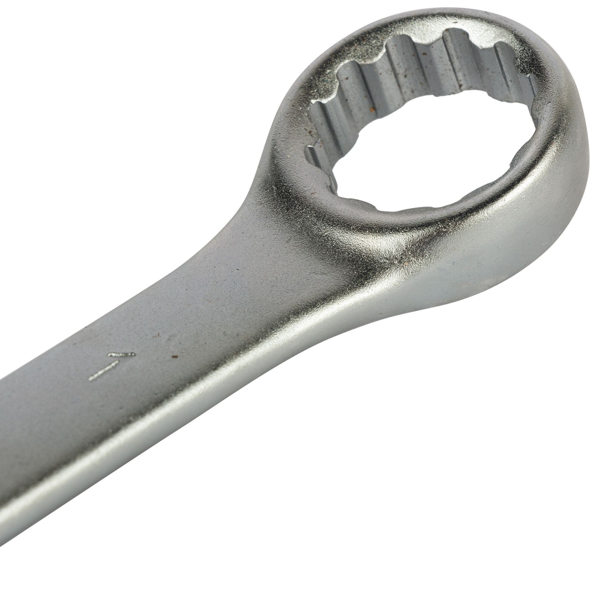 Close-up view of a metallic box-end wrench showing its circular, toothed opening.
