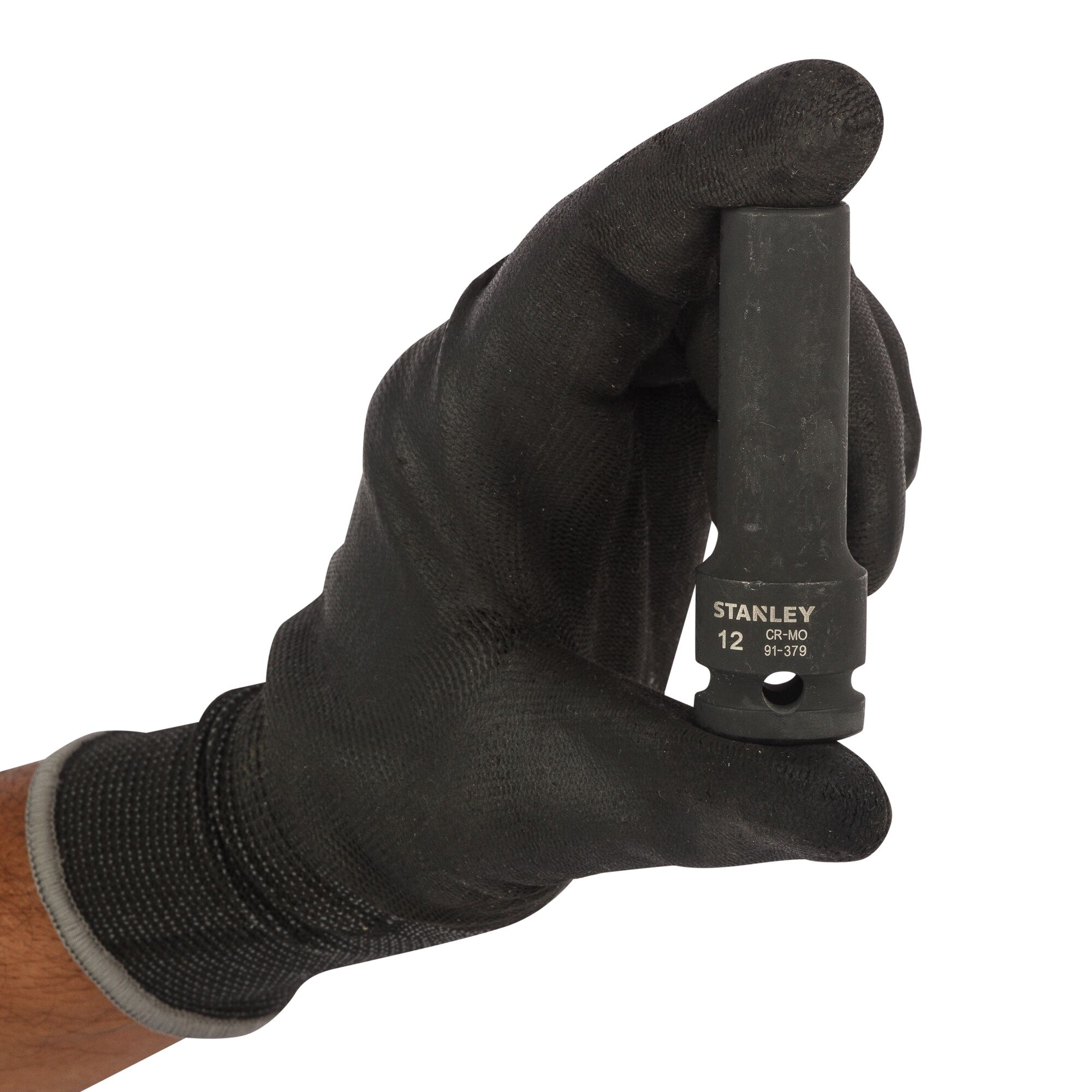 Photo of STANLEY STMT91379-8B socket held in gloved hand, front angle, black metal tool for automotive use.